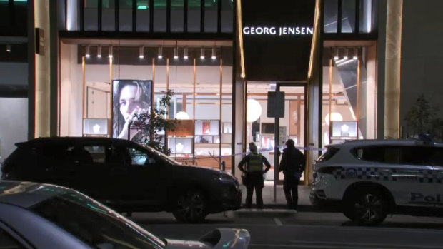Police outside the Collins Street store on Friday.