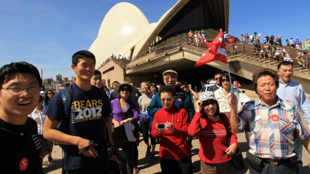 Chinese tourists on a tour of the Sydney Opera House.