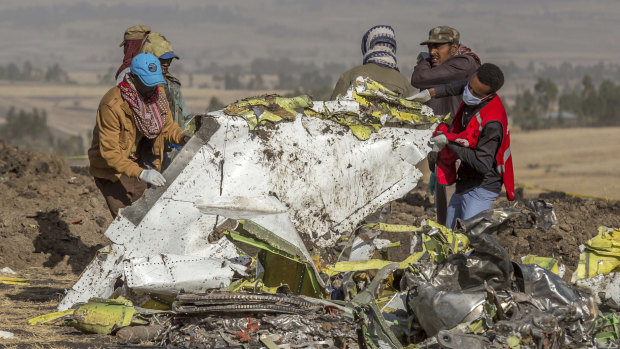 Rescue workers comb the scene of the Ethiopian Airlines crash.