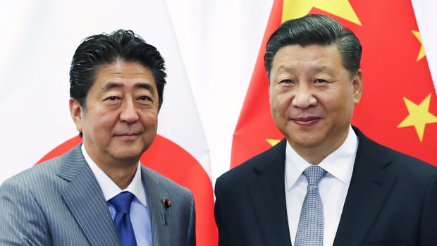 Chinese President Xi Jinping, right, with Japanese Prime Minister Shinzo Abe, representing two of Australia's most important trading partners.