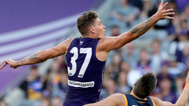 Rory Lobb and Stefan Martin  contest during the Round 10 AFL match between the Fremantle Dockers and the Brisbane Lions at Optus Stadium.