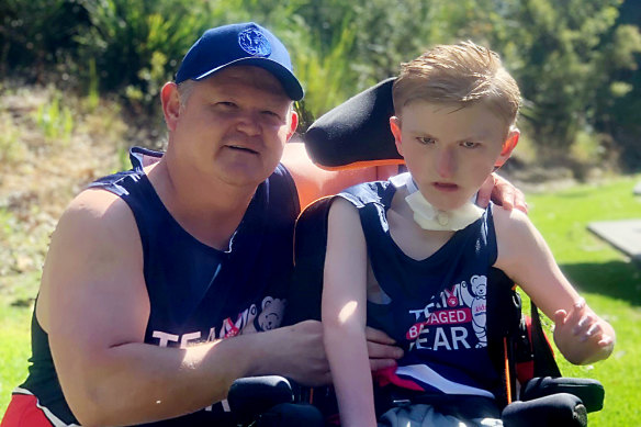 Grant Doyle with his son Kobi. The Doyle family has raised $2500 for this year’s City2Surf.