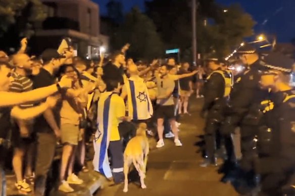 Police separate the two groups as clashes over Gaza broke out near Princes Park in Caulfield.