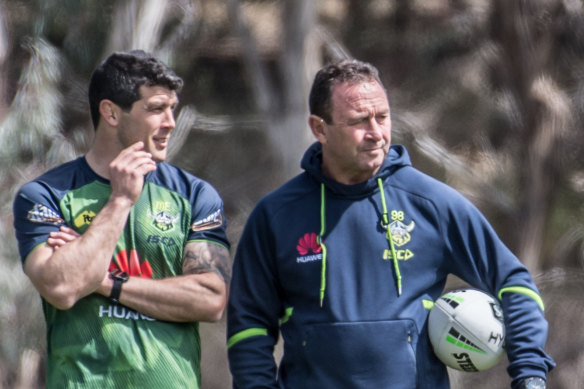 Odd couple: Michael Ennis with Ricky Stuart at a Canberra training session.