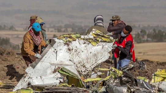 Rescue workers comb the scene of the Ethiopian Airlines crash.