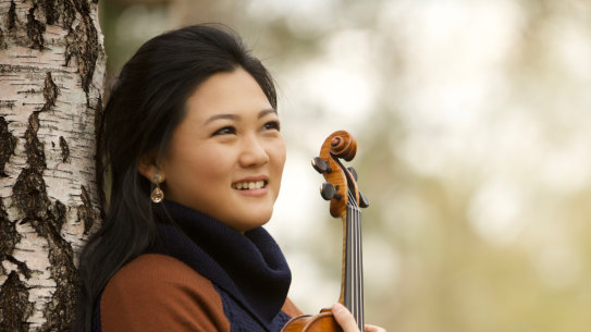 Emily Sun seems to breathe as one with pianist Andrea Lam in their expressive collaboration.