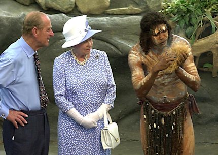 Prince Philip and the Queen in Cairns in 20002 watch as Warren Clements of the Tjapakai dance group makes fire.