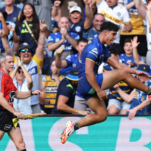 Blaize Talagi celebrates a try on his NRL debut.