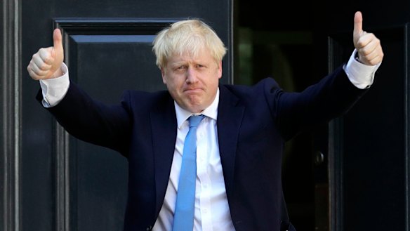 Newly-elected leader Boris Johnson arrives at Conservative party HQ in London.