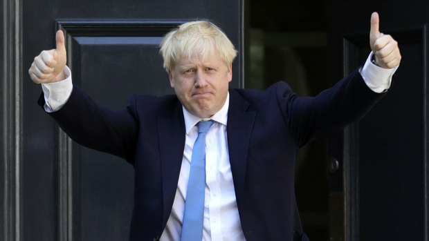 Newly-elected leader Boris Johnson arrives at Conservative party HQ in London.