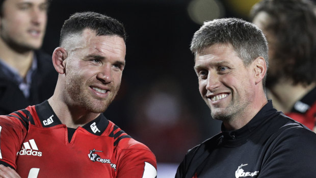All smiles: Crusaders Ryan Crotty, left, talks with assistant coach Ronan O'Gara.