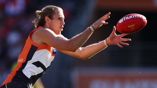 Nick Haynes grabs a loose ball against the Swans.