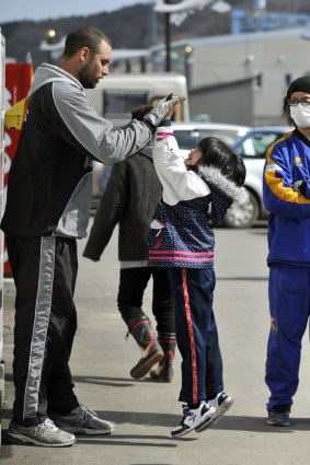 Rebuilding: Scott Fardy meets a young Japanese girl during the rebuilding process.