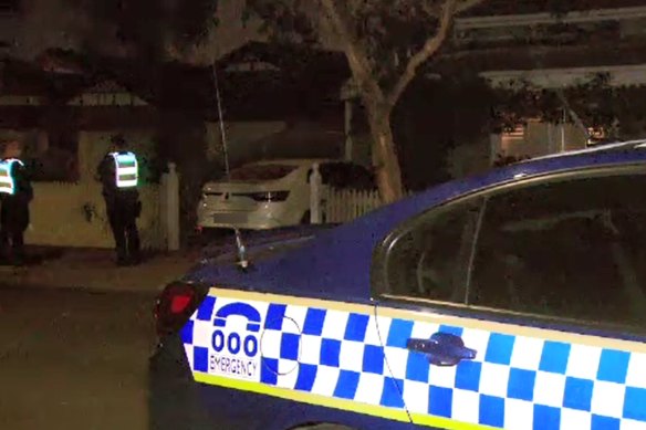 Police outside a house on Henderson Street Northcote, where a 49-year-old women believed to have died with Covid-19 in August. 