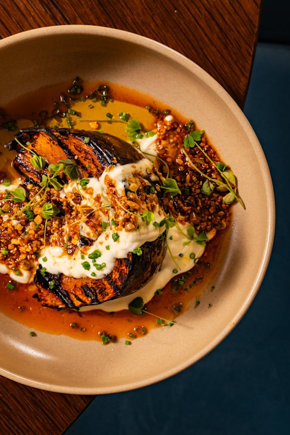 Ember-cooked kent pumpkin with mayo crema and chilli crunch.