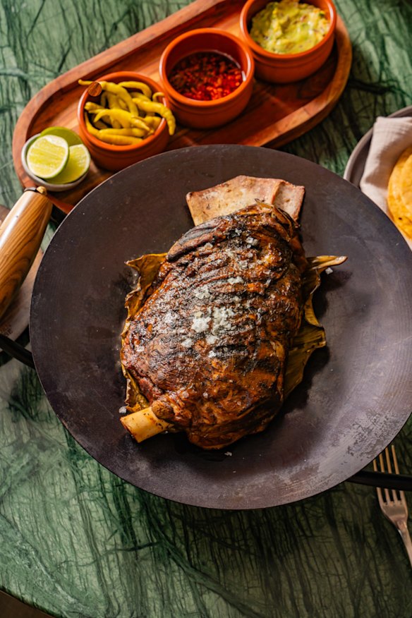 Lamb shoulder barbacoa with chipotle salsa, tortillas and pickles. 