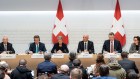 Credit Suisse, UBS, and Swiss banking authorities announce the shotgun marriage of the two giant Swiss banks. 