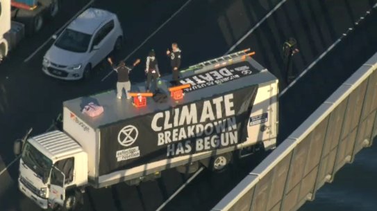 Deanna ‘Violet’ Coco, Bradley Homewood and Joseph Zammit climbed onto the roof of a truck parked across three lanes of traffic on the West Gate Bridge.