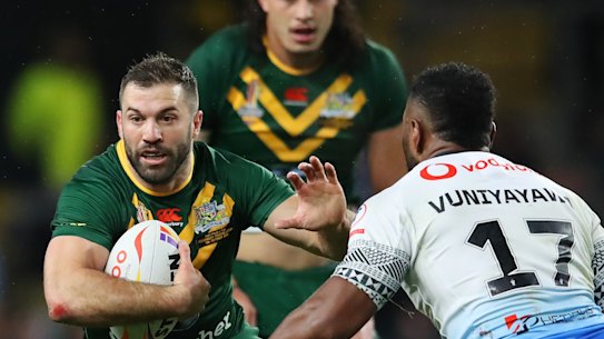 James Tedesco is put under pressure by King Vuniyayawa of Fiji during the Rugby League World Cup match between Australia and Fiji.