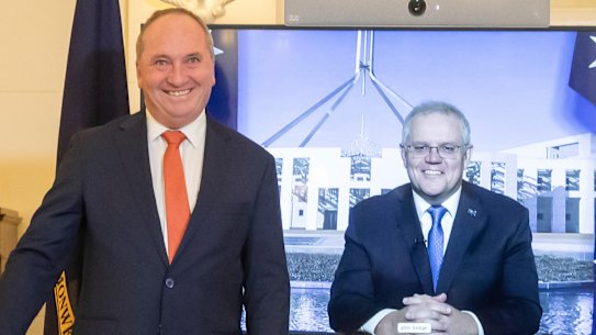 Nationals leader Barnaby Joyce reacting to son Sebastian as he poses for photos during the swearing-in ceremony as Deputy Prime Minister.