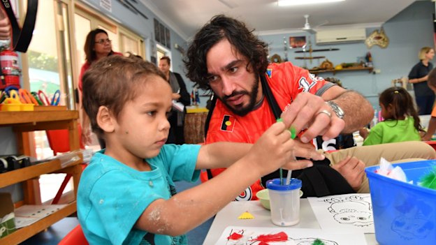 'That’s the one thing that I regretted; that I didn’t apply myself (at school) to have something to fall back on.' Johnathan Thurston with children from the Camp Koobara Aboriginal and Torres Strait Islander Kindergarten in Brisbane. 