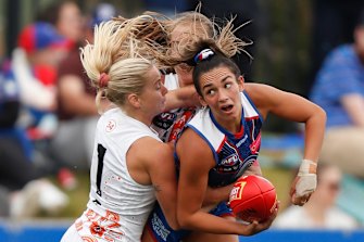 The Bulldogs’ Elisabeth Georgostathis is wrapped up by Emily Goodsir of the Giants.