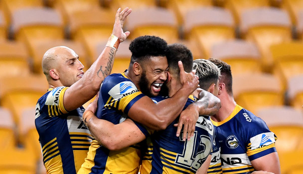 Waqa Blake celebrates his try for the Eels against the Broncos at Suncorp Stadium on Thursday night.