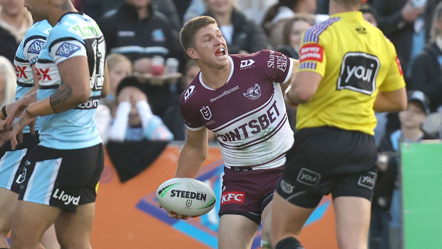 Reuben Garrick celebrates a Manly try.