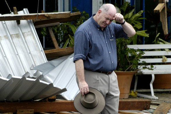 Sir Peter Cosgrove surveys damage after Cyclone Larry in Queensland in 2006.