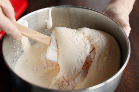 When folding dry ingredients into a cake batter with a foam base, use long and deliberate strokes.