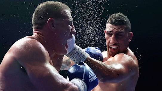 Justis Huni lands a left hand on Paul Gallen during his win over the former league star.