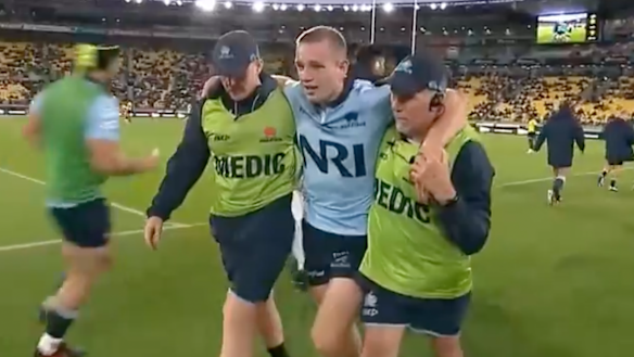 Max Jorgensen leaves the field after being injured against the Hurricanes.