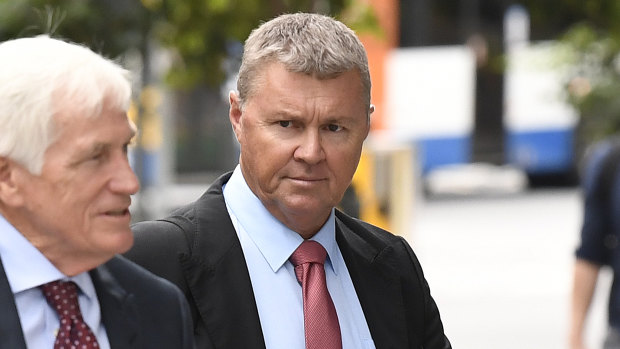 Ex-CFMEU boss David Hanna (right) arriving at court on Monday morning with legal counsel.