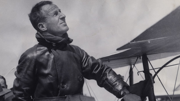 Sir Charles Kingsford Smith climbs out of his Lockheed plane called the "Lady Southern Cross' at Municipal Airport, Inglewood, California in 1934. 