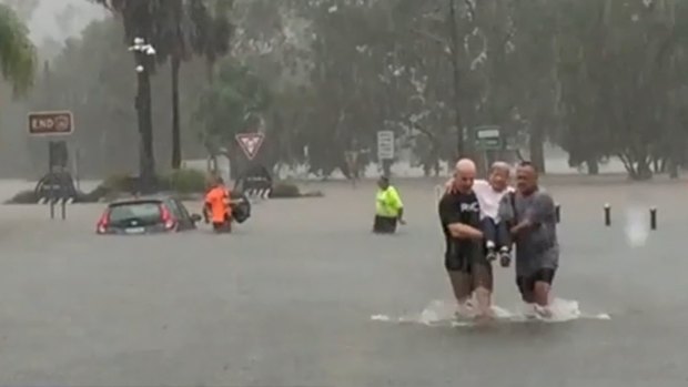 Adam Bailey and Alan Blanch, co-owners of Northern Rivers Collectables, helped save an elderly woman from drowning in floodwaters in Lismore on Wednesday.