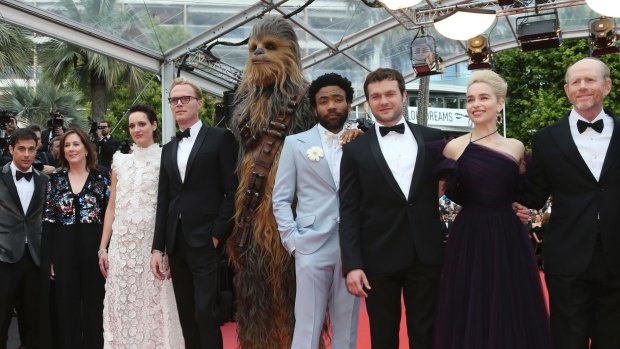 Producer Kathleen Kennedy, Phoebe Waller-Bridge, Paul Bettany,  Chewbacca, Donald Glover, Alden Ehrenreich, Emilia Clarke and director Ron Howard at the Cannes premiere of Solo: A Star Wars Story.