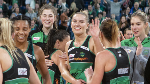 Fever players  celebrate their victory after the Round 13 Super Netball match.