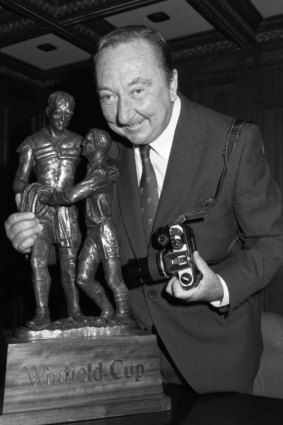 Photographer John O'Gready, with the Rugby League Winfield Cup trophy in 2007, which was based on O'Gready's award-winning photo of St George's Norm Provan and Western Suburb's Arthur Summons at the end of the 1963 Rugby League Grand Final. 