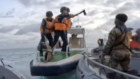 In this handout photo provided by Armed Forces of the Philippines, Chinese Coast Guards hold an axe as they approach Philippine troops on a resupply mission in the Second Thomas Shoal at the disputed South China Sea on June 17, 2024.