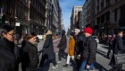 Shoppers in New York. The US economy continues to grow, but consumer are easing off.