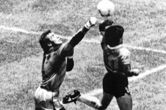 Maradona scores the infamous ‘Hand of God’ goal at the 1986 World Cup.