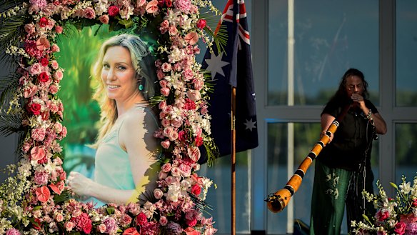 Johanna Morrow plays the didgeridoo during a memorial service for Justine Ruszczyk Damond at Lake Harriet in Minneapolis in 2017.