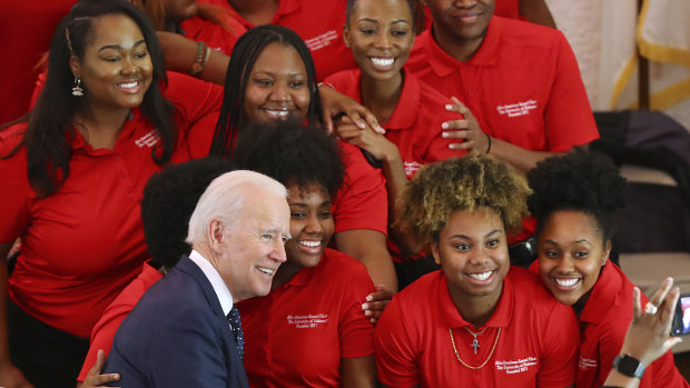 Democratic presidential candidate and former vice-president Joe Biden takes a picture with the choir at the Brown Chapel African Methodist Episcopal Church in Selma, Alabama.