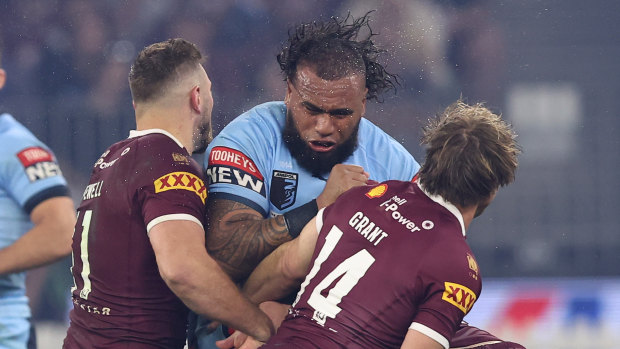 NSW prop Junior Paulo charges into the Maroons defence.