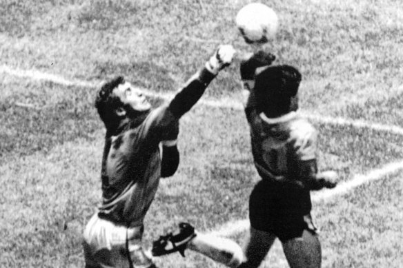 Maradona scores the infamous ‘Hand of God’ goal at the 1986 World Cup.