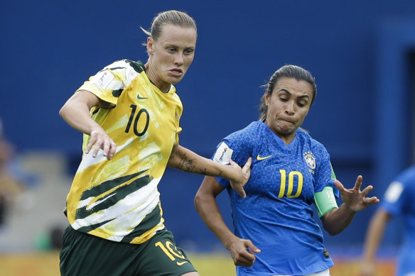 Australia's Emily van Egmond (left) challenges Brazil's Marta at this year's Women's World Cup.