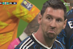 Lionel Messi stares at Jude Bellingham.