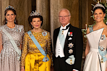 King Carl XVI Gustaf of Sweden with Queen Silvia and their daughters Crown Princess Victoria (right) and Princess Madeleine (left) in 2025 at the Royal Palace.