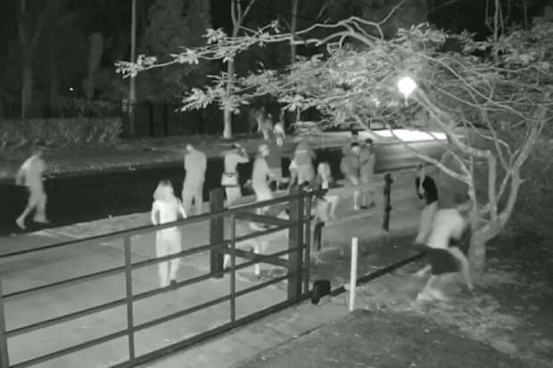 Young people caught on camera dispersing after police arrive to shut down the party.