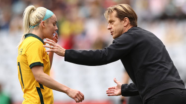 Matildas head coach Tony Gustavsson speaks with Ellie Carpenter during the 3-0 loss on Saturday.